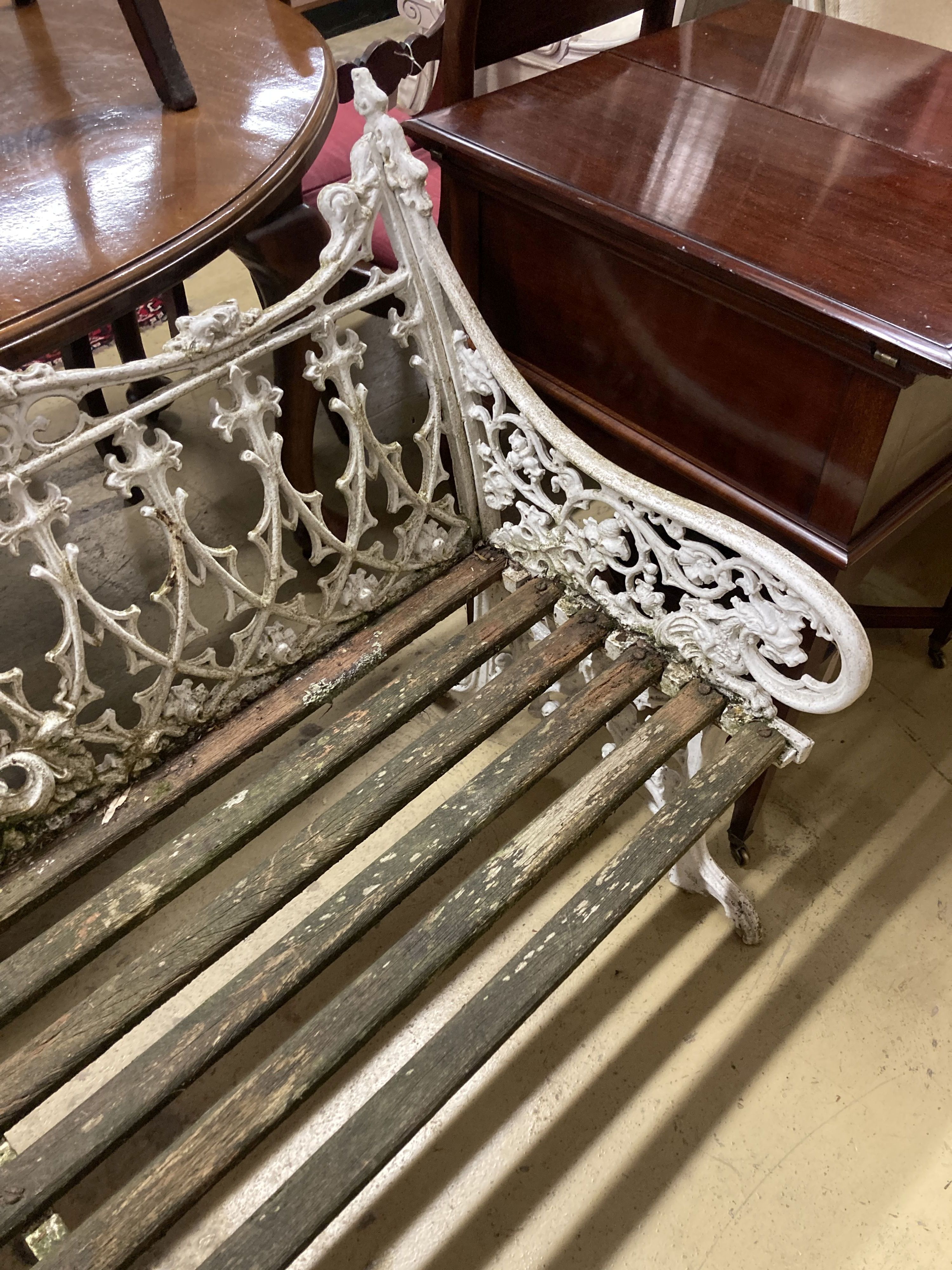 A Victorian style Coalbrookdale design painted cast metal garden bench with slatted wood seat, length 150cm, depth 55cm, height 100cm